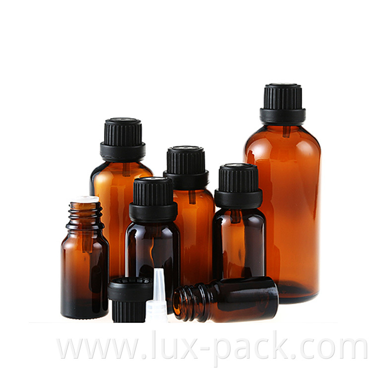 Wholesale New Empty Amber Cosmetic Essential Oil Glass Bottle With Tamper Evident Cap